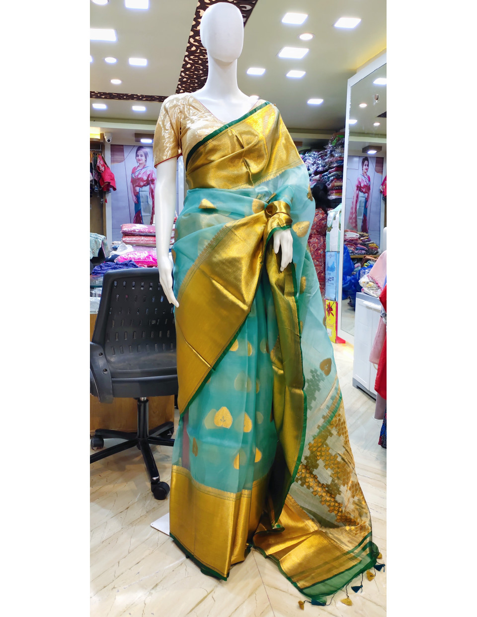 Premium Quality Sky Organza Silk Saree With Reshmi Zari Weaving Wide Border And Butta Weaving Work On All Over Base (KR2259)